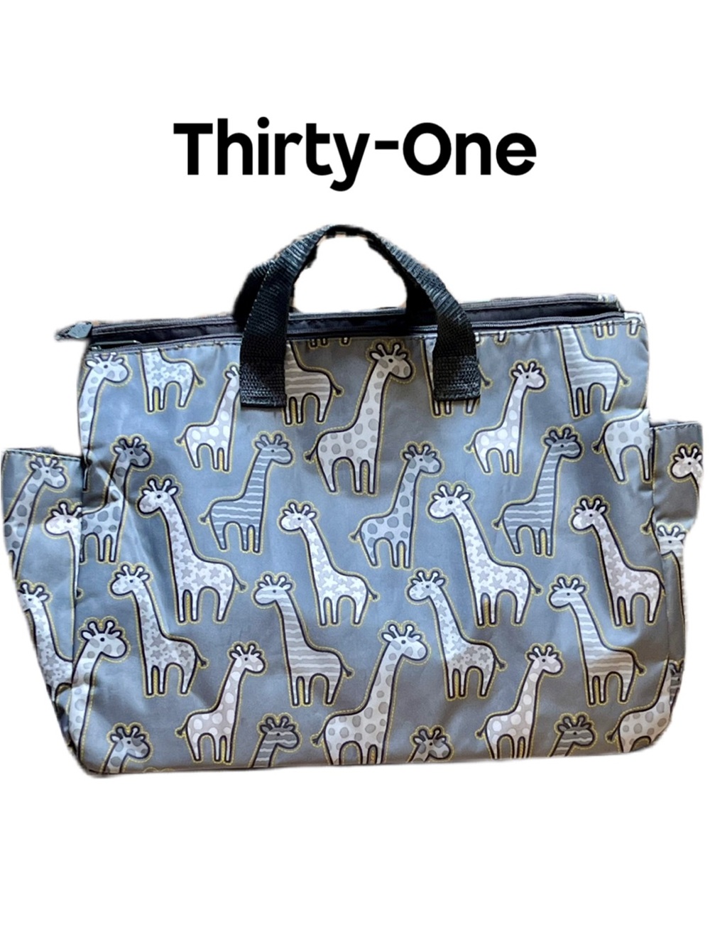 Thirty-One Zip-Top Tote in the Go Go Giraffe print with seven pockets